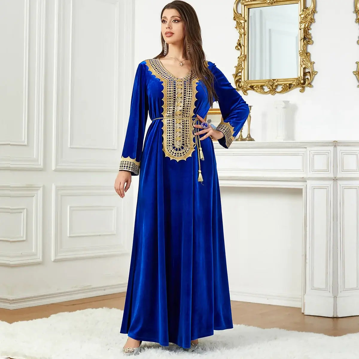 Woman wearing luxurious blue Morocco Party Dress with intricate lace-up detailing in a sophisticated setting.