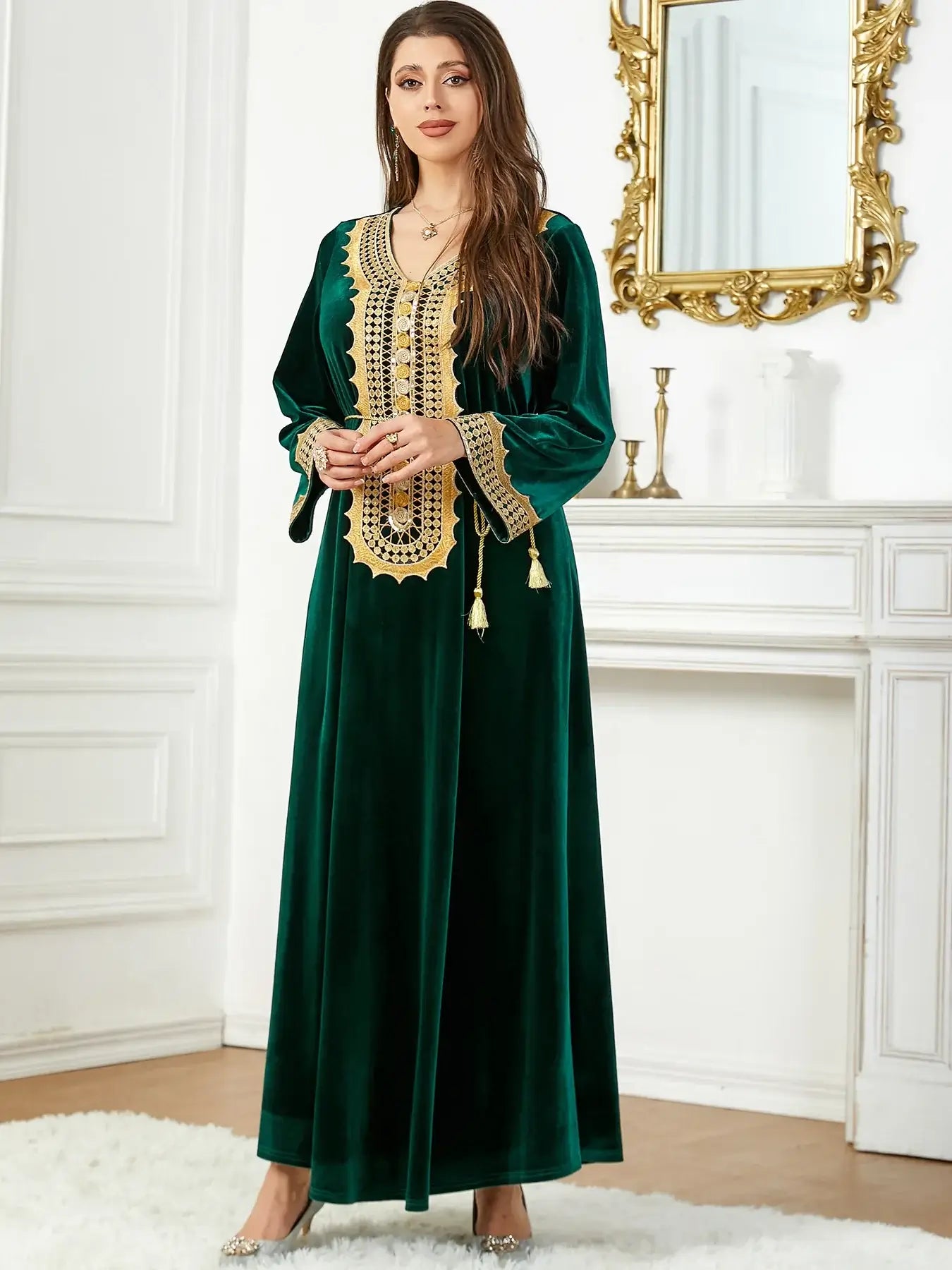 Woman wearing a luxurious Morocco Party Dress for women, green velvet with intricate lace-up detailing, in an elegant setting.