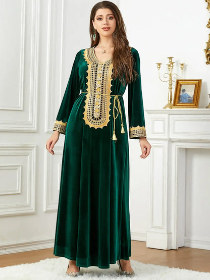 Woman in a luxurious Morocco party dress with intricate lace-up detailing and thicken velvet fabric.