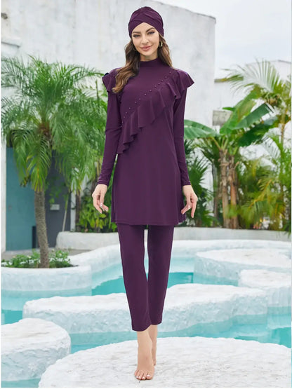 Woman wearing modest burkini set with hijab, top, and pants, standing near a pool. Perfect for Muslim swimwear, beach outings, and water activities.